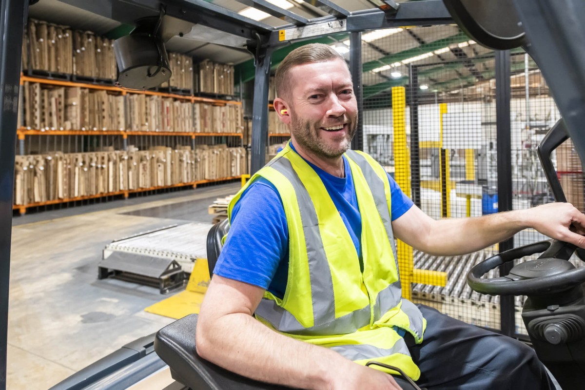 14268 Smiling Forklift Truck Driver In The Warehouse